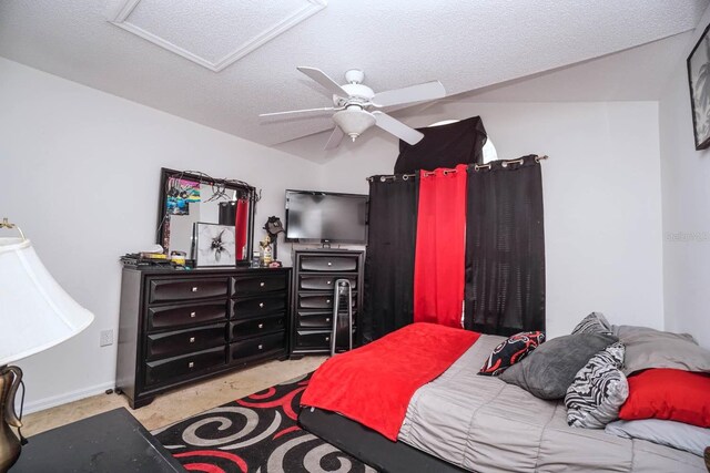 carpeted bedroom featuring ceiling fan and a textured ceiling