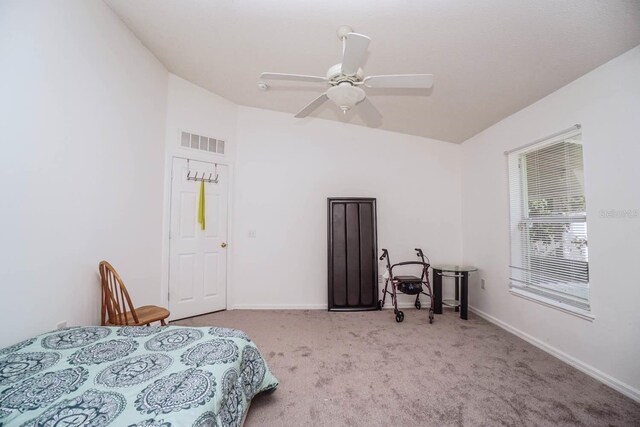 bedroom featuring light colored carpet and ceiling fan