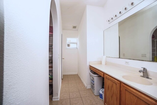 bathroom with vanity and tile patterned floors