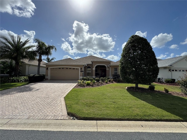 view of front facade with a garage and a front yard