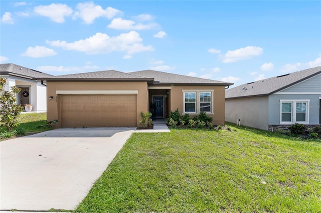 view of front facade with a garage and a front lawn