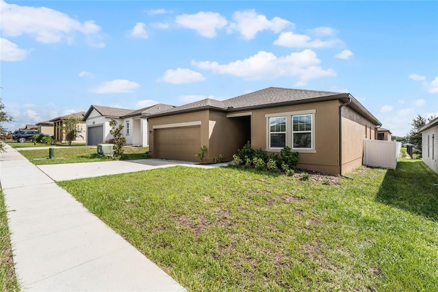 view of front of home with a garage and a front yard