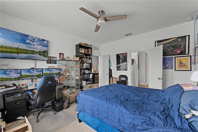 bedroom featuring ceiling fan and light colored carpet