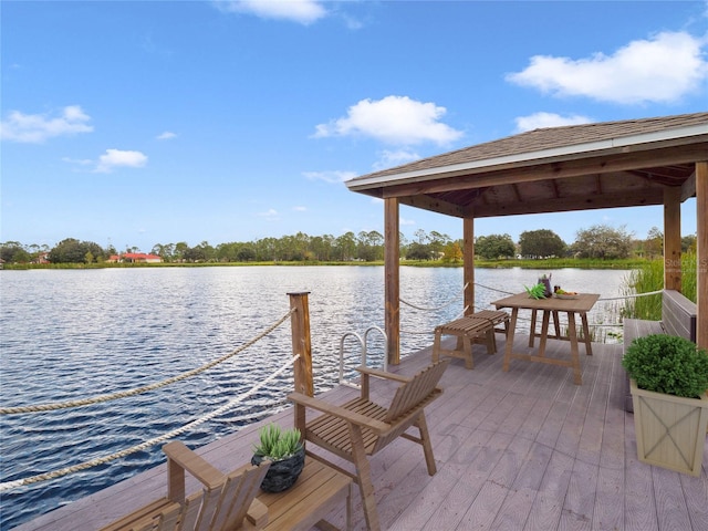 view of dock featuring a water view and a gazebo