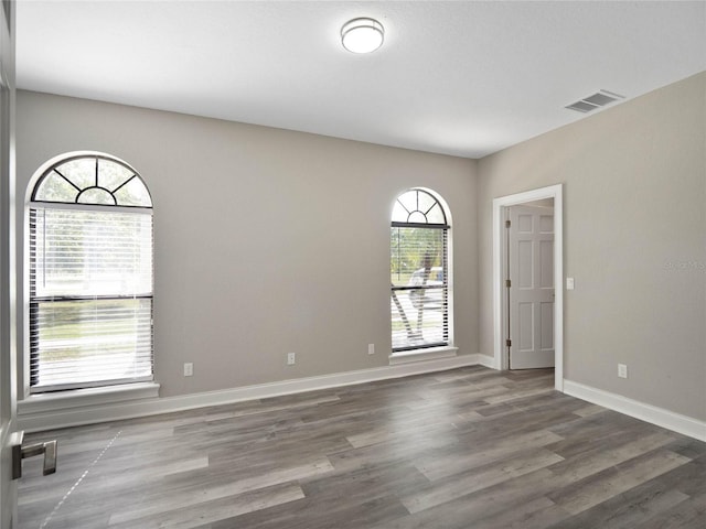 empty room featuring hardwood / wood-style flooring