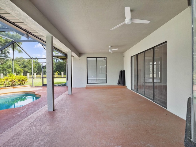 view of patio / terrace with glass enclosure and ceiling fan