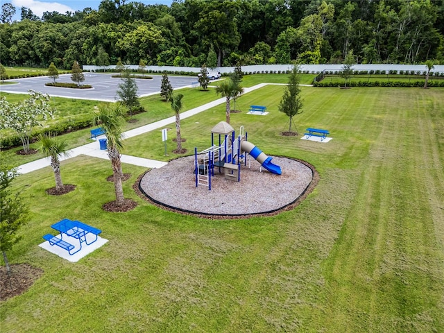 view of playground featuring a lawn