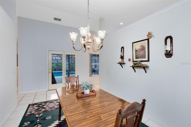 tiled dining area featuring a notable chandelier and crown molding