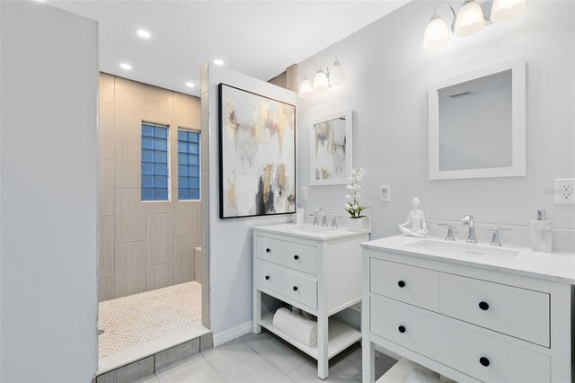 bathroom featuring walk in shower, tile patterned flooring, and vanity