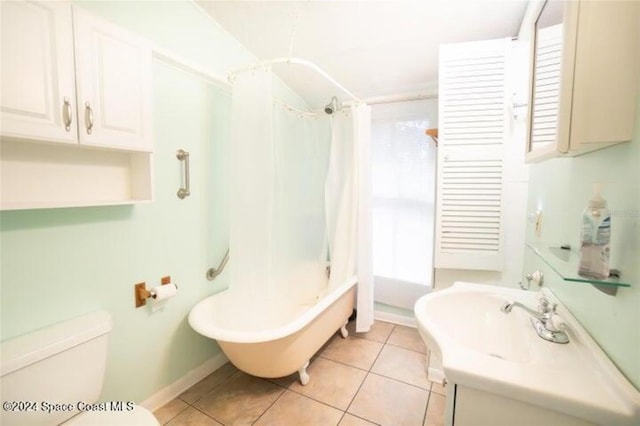 bathroom featuring shower / bath combo with shower curtain, toilet, and tile patterned flooring