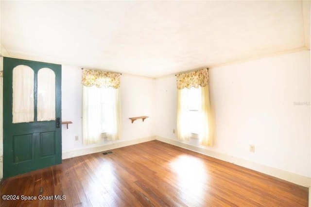 entryway with hardwood / wood-style floors