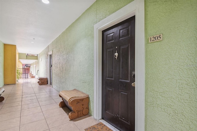 1810 E Palm Ave Unit 1205, Tampa, FL 33605 - property entrance with stucco siding and a balcony