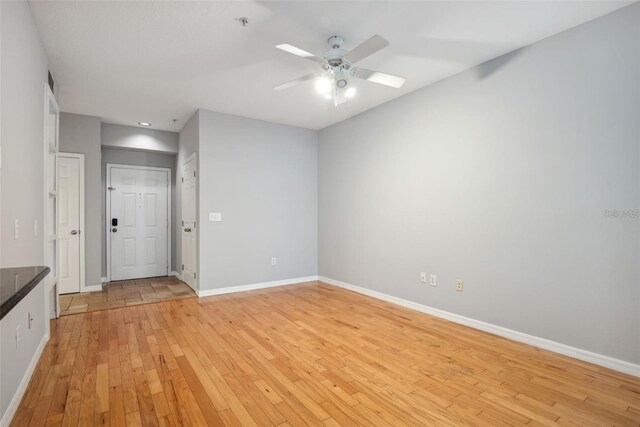 1810 E Palm Ave Unit 1205, Tampa, FL 33605 - spare room with baseboards, a ceiling fan, light wood-style flooring, and a pendent fire sprinkler