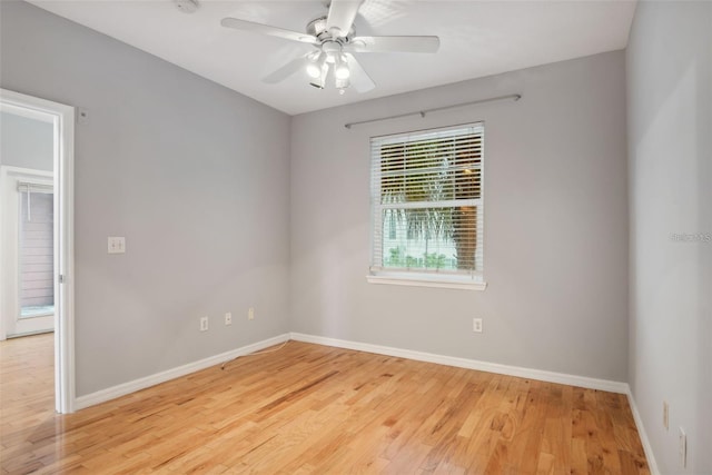 unfurnished room featuring light wood-type flooring and ceiling fan