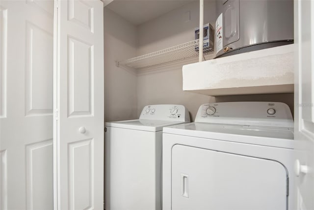 laundry area with washing machine and clothes dryer