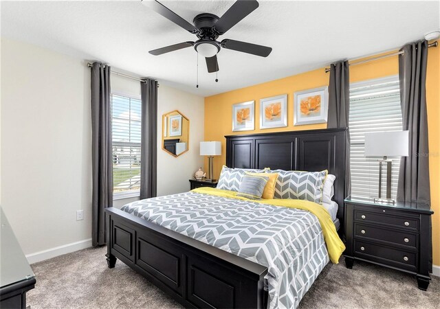 bedroom featuring ceiling fan and carpet