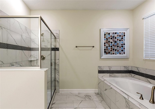 bathroom featuring shower with separate bathtub