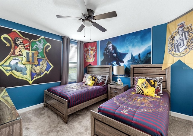 bedroom with a textured ceiling, carpet floors, and ceiling fan