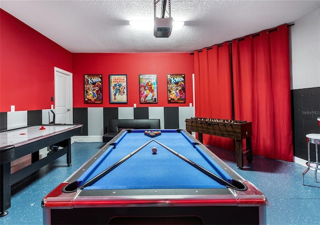 game room featuring a textured ceiling