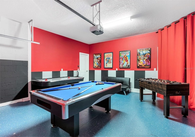 playroom with a textured ceiling