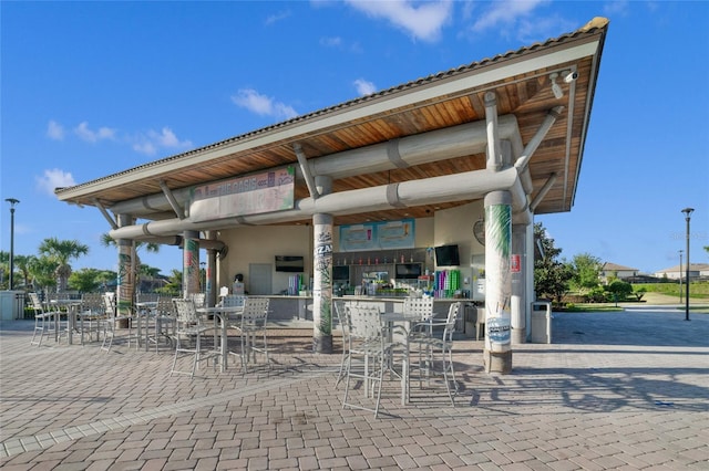 view of patio with an outdoor bar