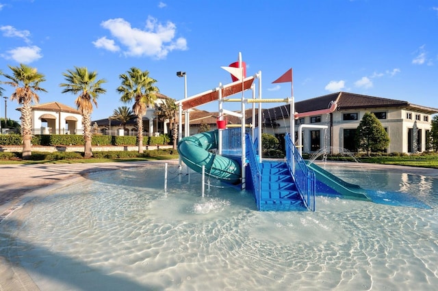 view of pool with a water slide