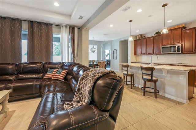 living room with light tile patterned flooring