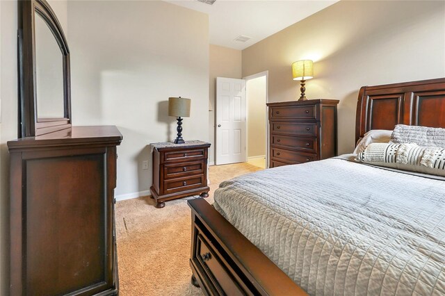 bedroom with light carpet