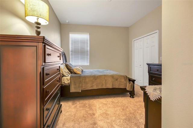 carpeted bedroom featuring a closet