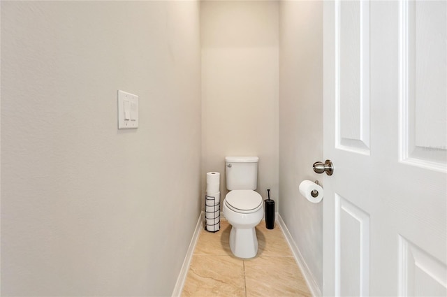 bathroom featuring toilet and tile patterned floors