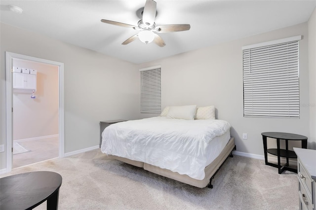 bedroom featuring light carpet and ceiling fan