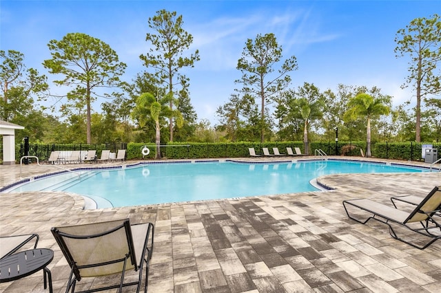 view of pool featuring a patio