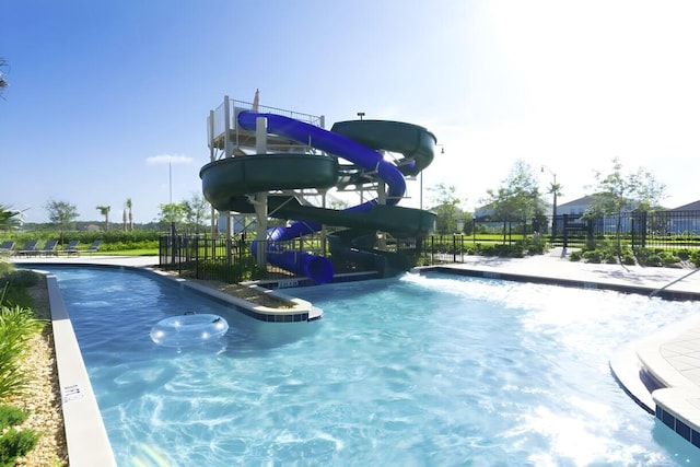 view of swimming pool featuring a water slide