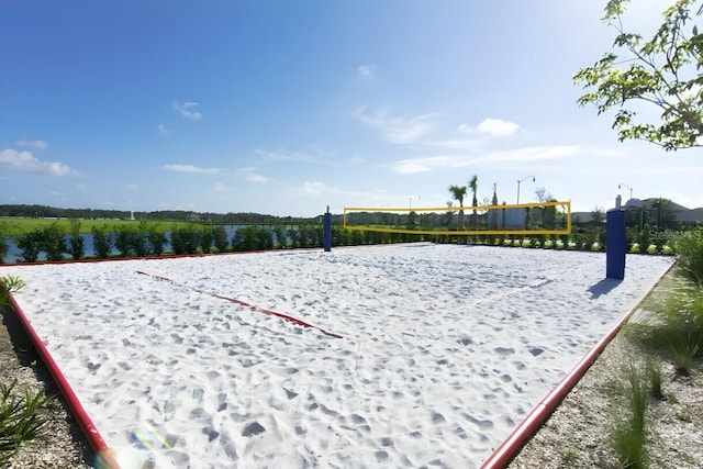 view of home's community featuring a water view and volleyball court