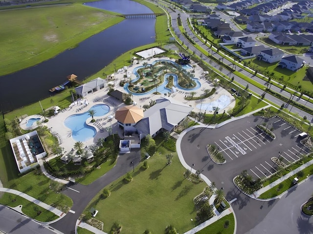 birds eye view of property featuring a water view