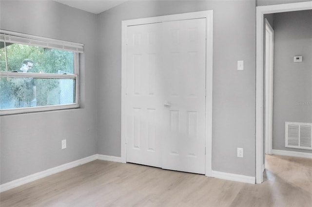 unfurnished bedroom with light hardwood / wood-style flooring