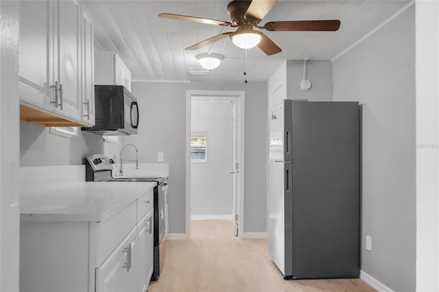 kitchen with white cabinetry, ceiling fan, stainless steel appliances, light hardwood / wood-style flooring, and crown molding