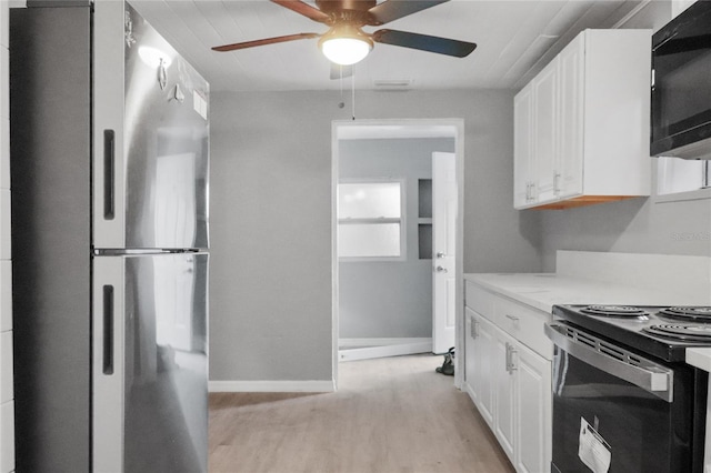 kitchen featuring white cabinets, light wood-type flooring, ceiling fan, and black appliances