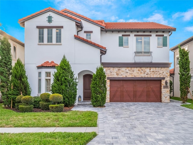 mediterranean / spanish-style home featuring a garage