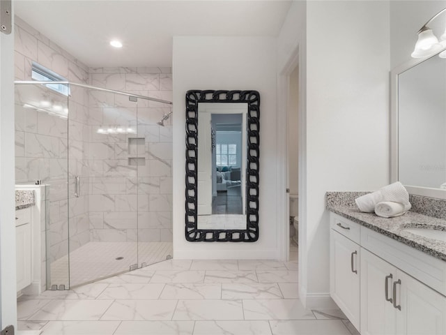 bathroom featuring walk in shower, vanity, and toilet