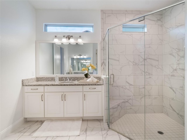 bathroom featuring walk in shower and vanity