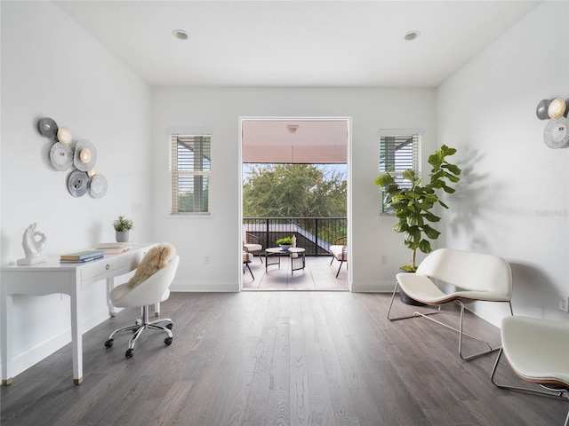 office space with wood-type flooring