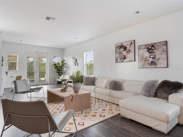 living room with french doors and hardwood / wood-style floors