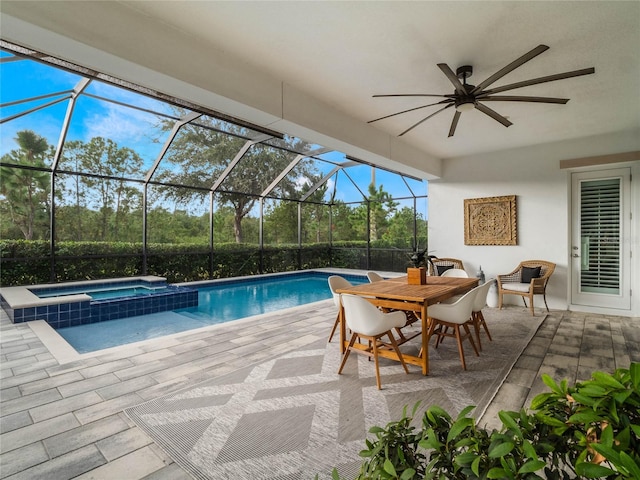 view of pool featuring a lanai, ceiling fan, an in ground hot tub, and a patio area