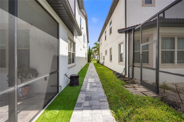 view of side of property featuring a lawn