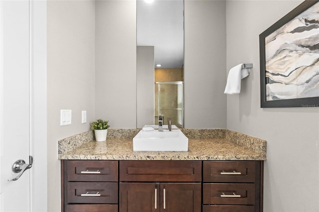 bathroom with vanity and walk in shower