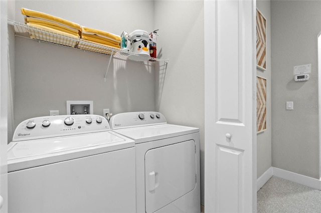 laundry room featuring carpet and separate washer and dryer