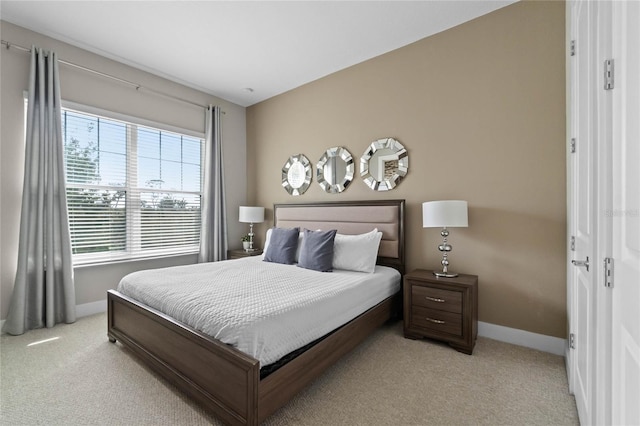 bedroom featuring light colored carpet