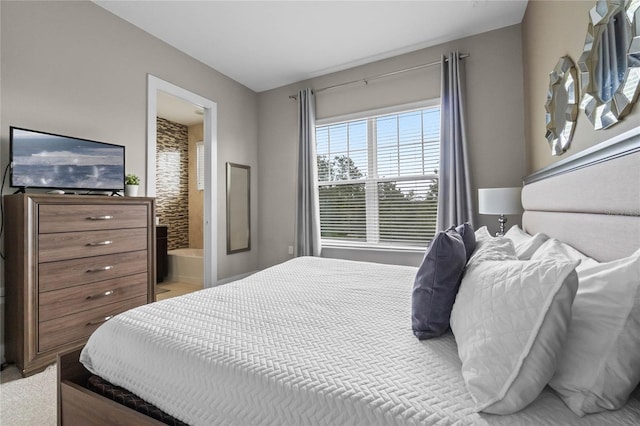 carpeted bedroom with ensuite bathroom