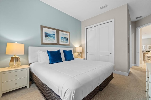 carpeted bedroom with a closet